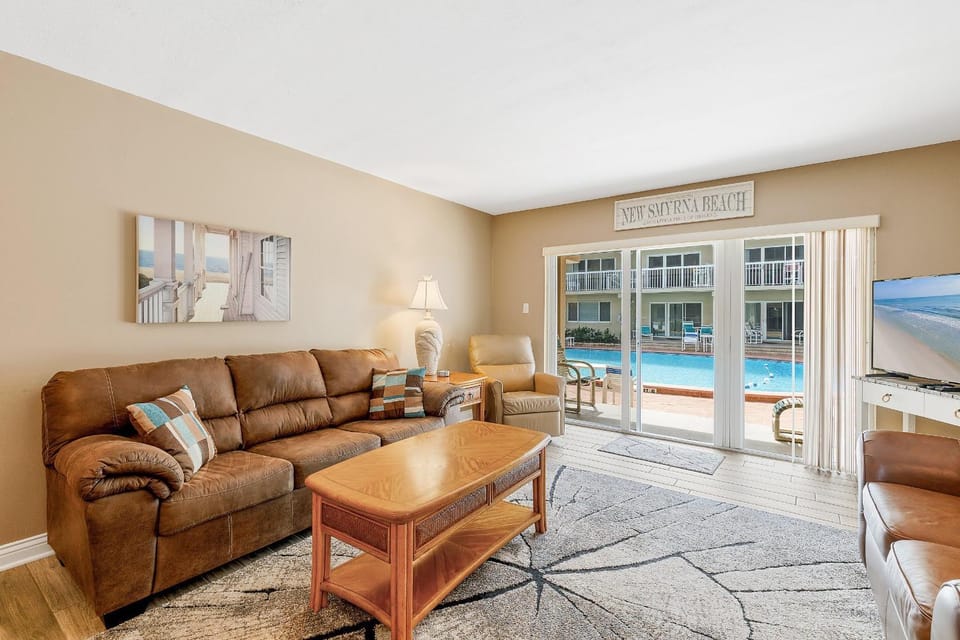 Living room, Seating area, Pool view