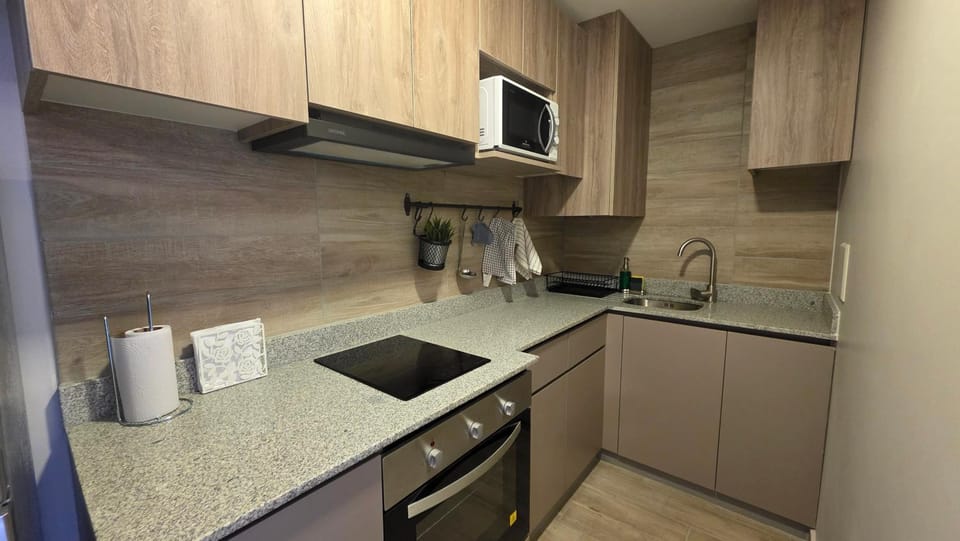 Kitchen or kitchenette, oven