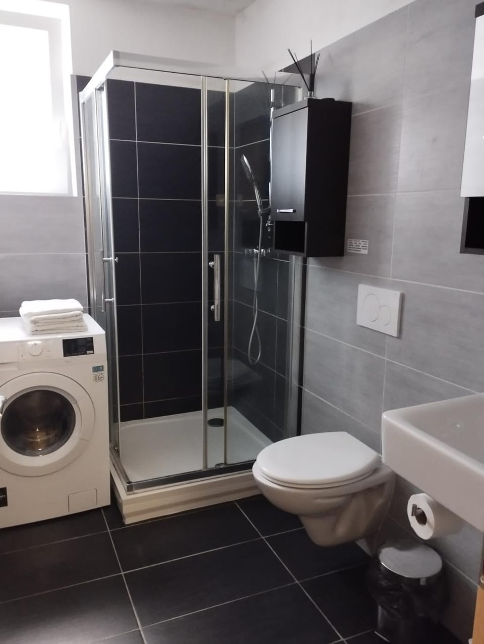 Shower, Toilet, Bathroom, towels, washing machine, dryer