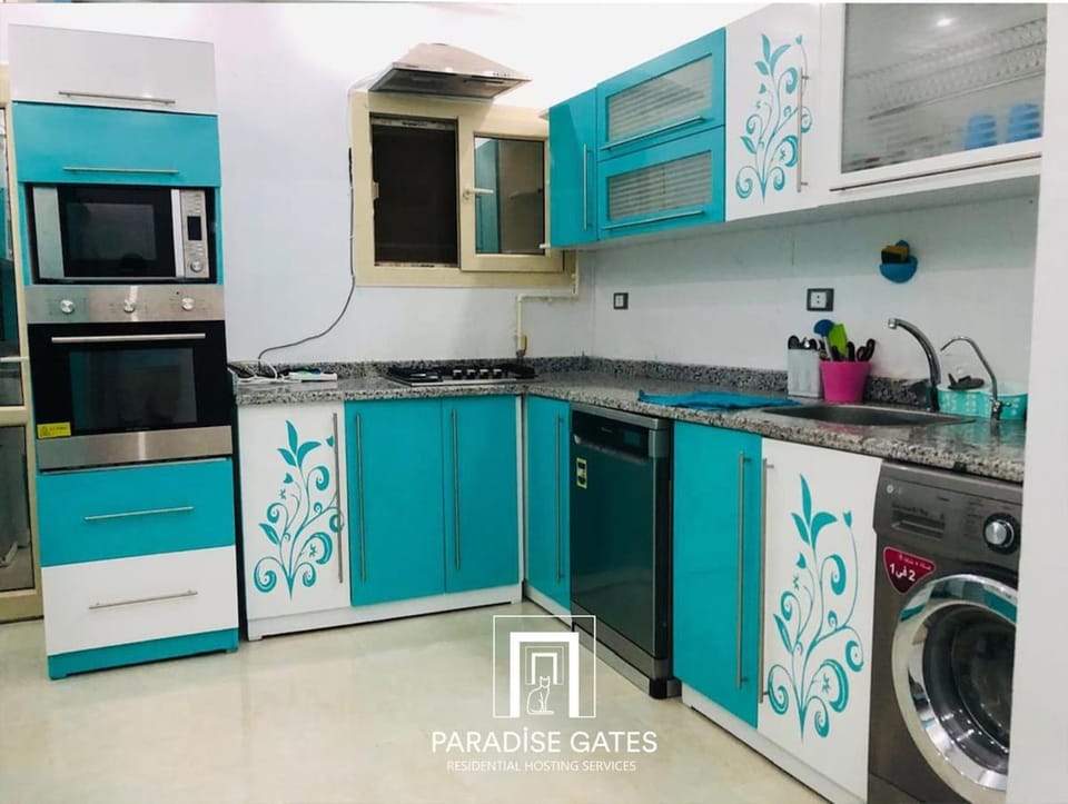 Kitchen or kitchenette, dishwasher, oven, stove, washing machine