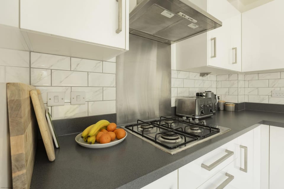 Kitchen or kitchenette, stove, toaster