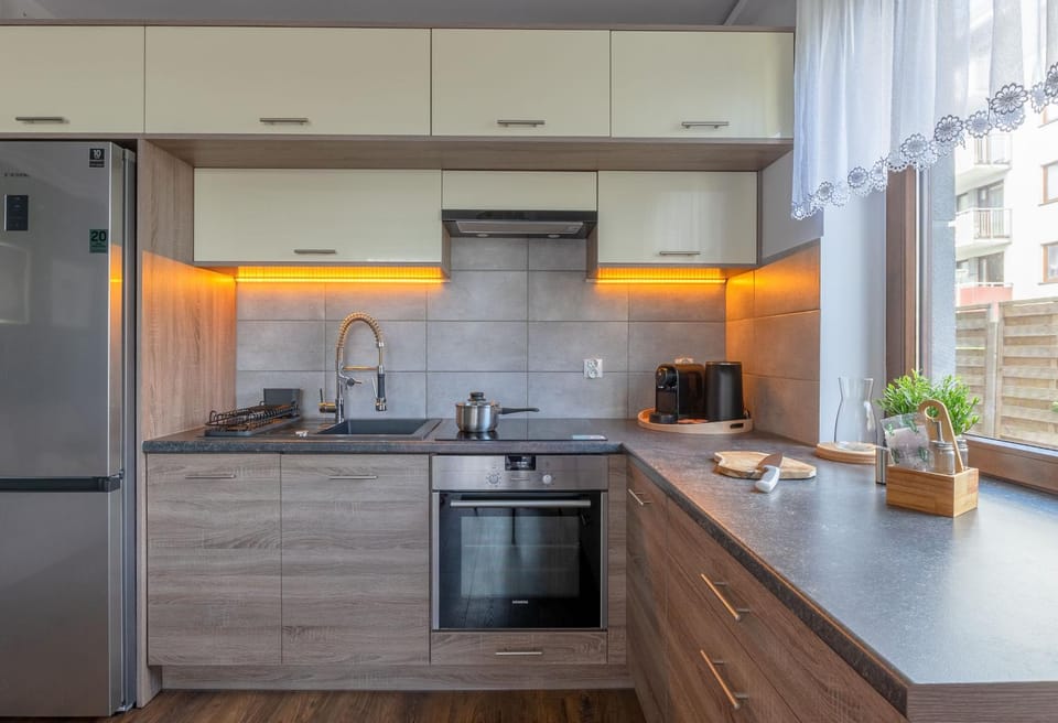 Kitchen or kitchenette, dishwasher, oven, stove