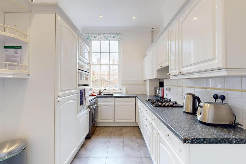 Kitchen or kitchenette, stove, toaster