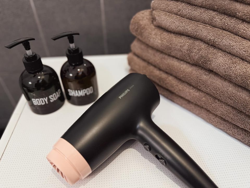Bathroom, hair dryier, towels