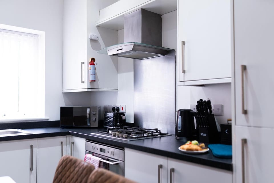 Kitchen or kitchenette, stove, toaster