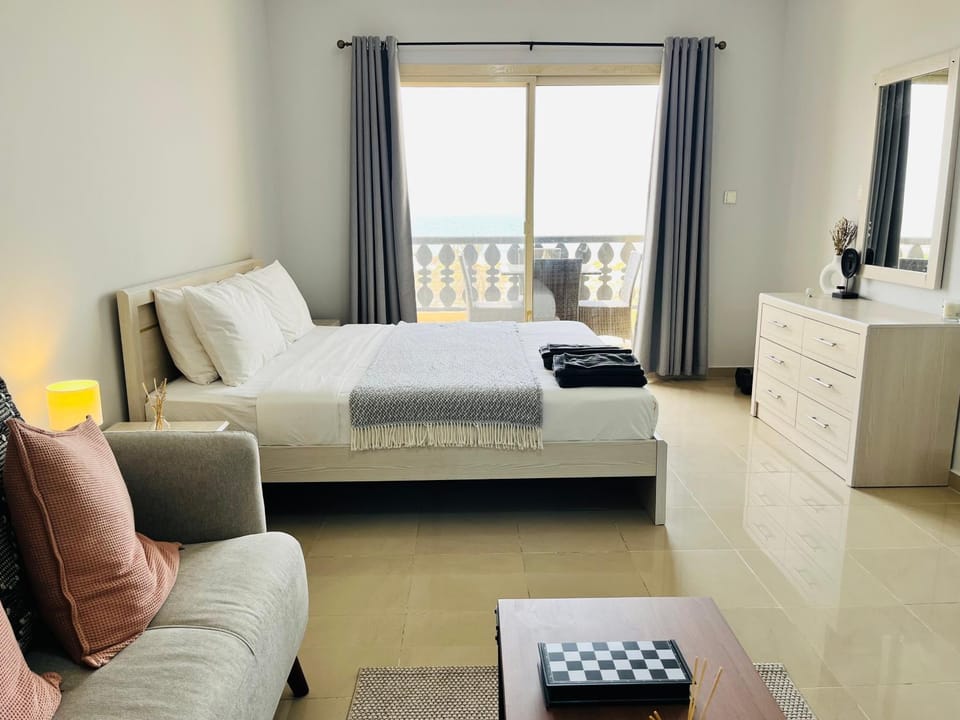 Bed, Living room, Seating area, Bedroom