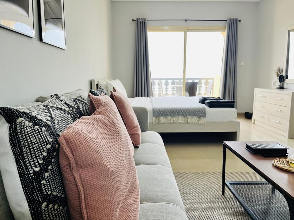 Bed, Living room, Seating area, Bedroom