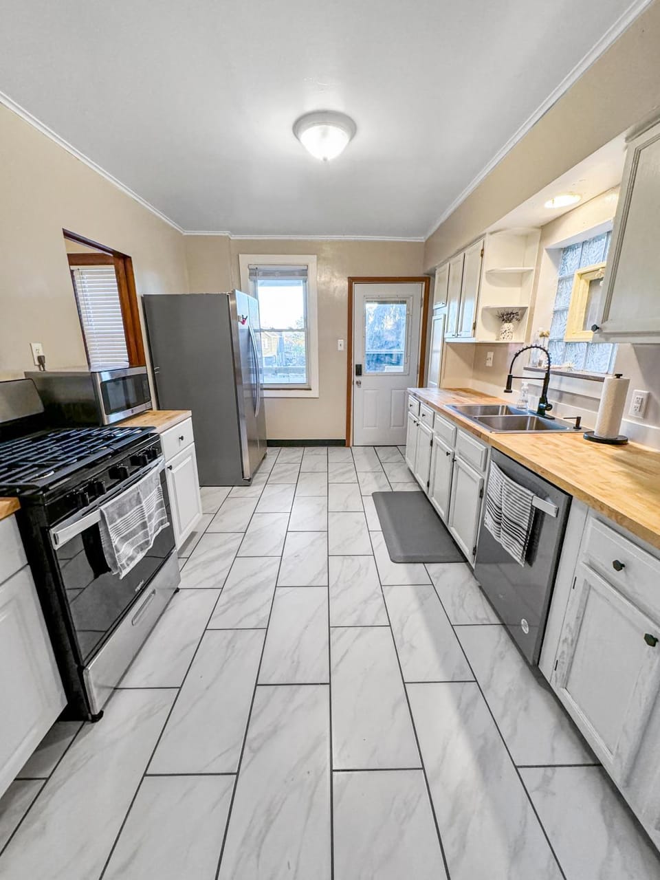 Kitchen or kitchenette, dishwasher, oven, stove, toaster