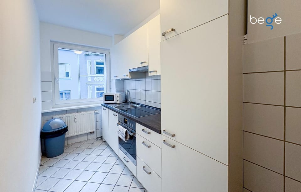 Kitchen or kitchenette, dishwasher, oven, stove