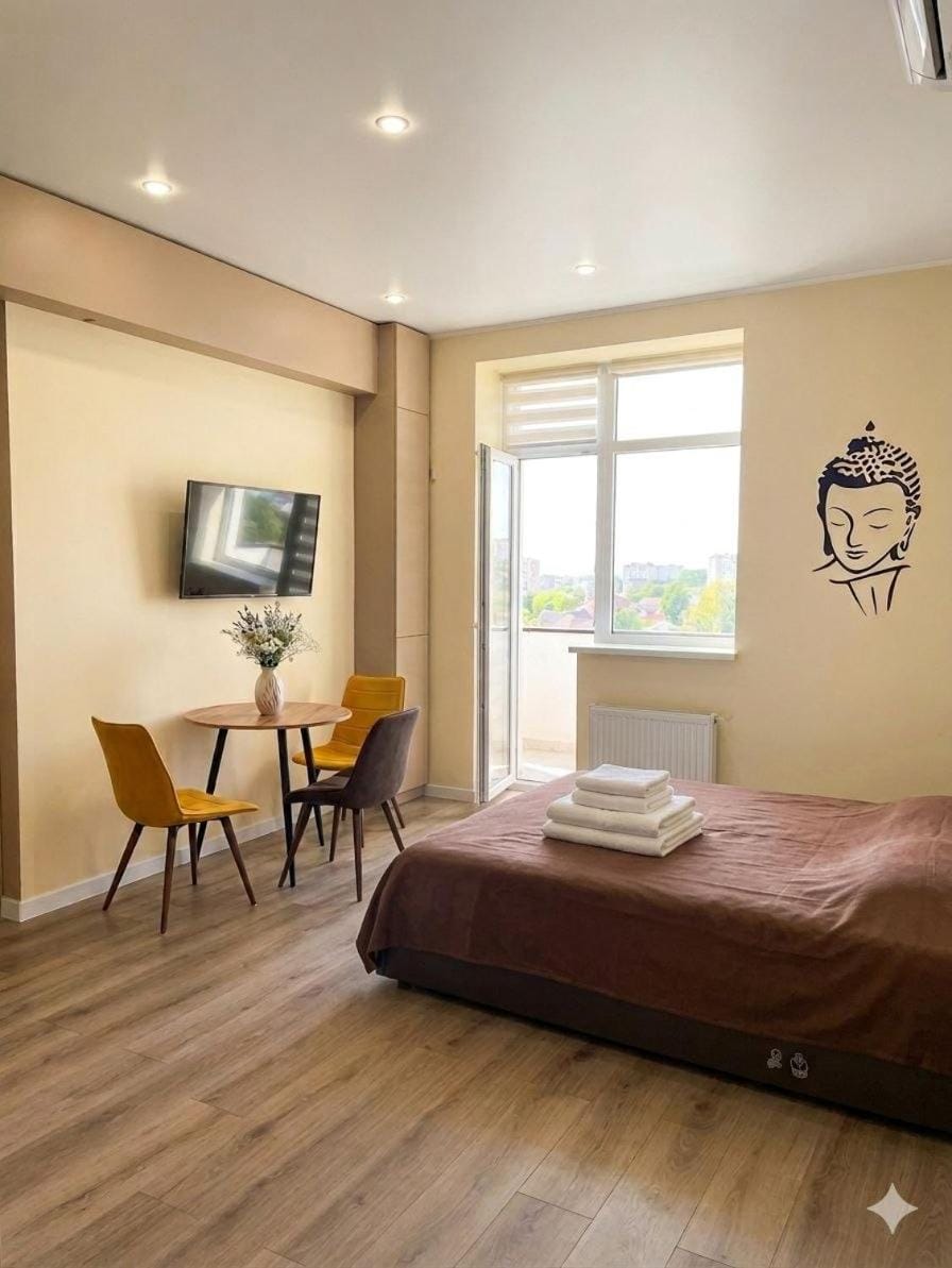 Bed, TV and multimedia, Living room, Seating area, Bedroom