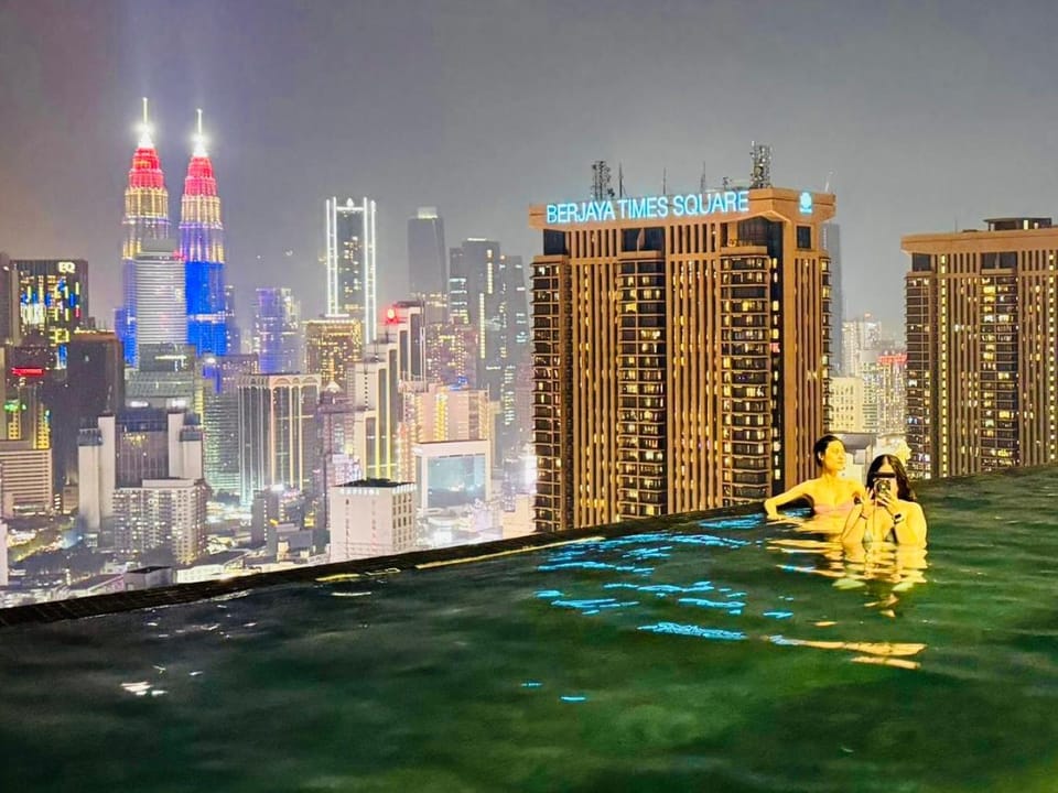 Property building, Restaurant/places to eat, Night, People, City view, Pool view, Swimming pool