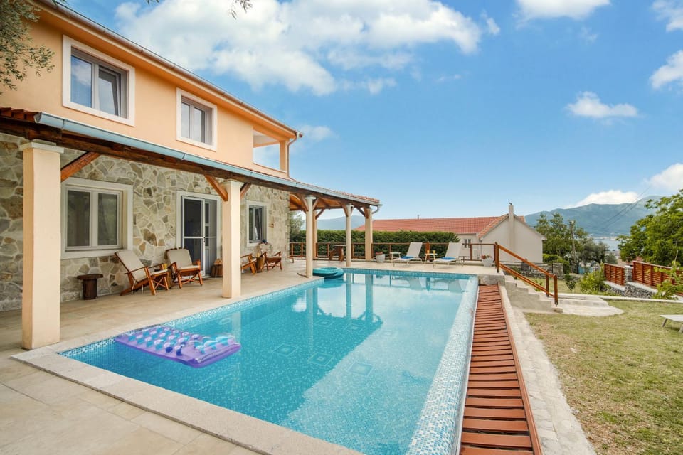 Property building, Patio, Natural landscape, Pool view, Swimming pool, sunbed
