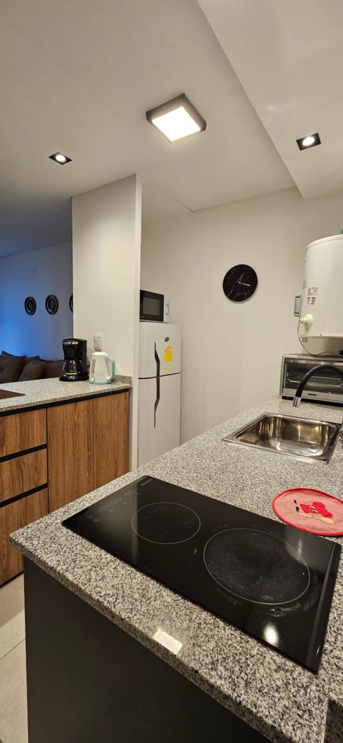 Kitchen or kitchenette, oven, stove