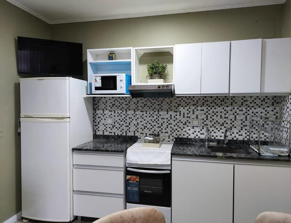 Kitchen or kitchenette, oven