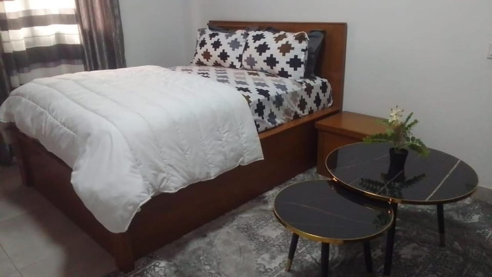 Bed, Living room, Seating area, Bedroom