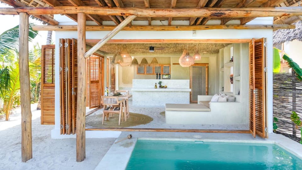 Patio, Bed, Natural landscape, Living room, Swimming pool, sunbed