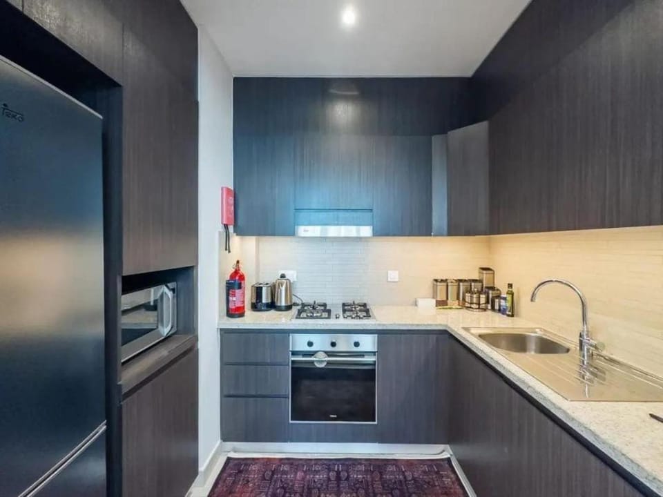 Kitchen or kitchenette, dishwasher, oven, stove