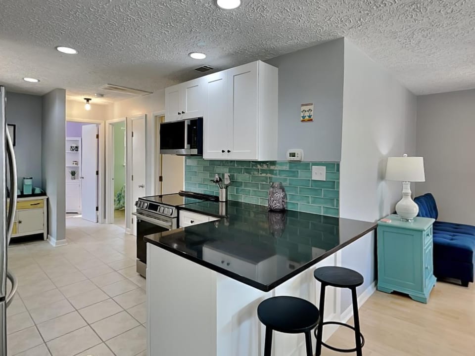 Kitchen or kitchenette, Seating area, furniture, stove, air conditioner