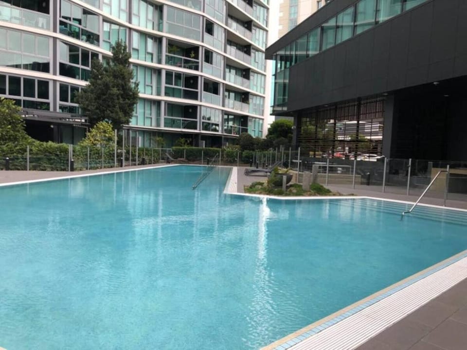 Property building, Day, Pool view, Swimming pool, sunbed