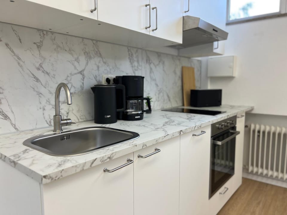 Kitchen or kitchenette, dishwasher, stove, toaster