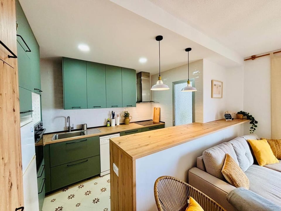 Kitchen or kitchenette, dishwasher, oven, stove