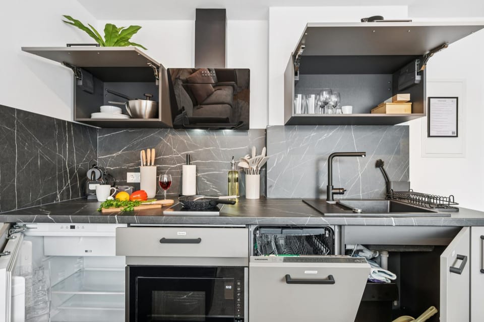 Kitchen or kitchenette, dishwasher, oven, stove, toaster