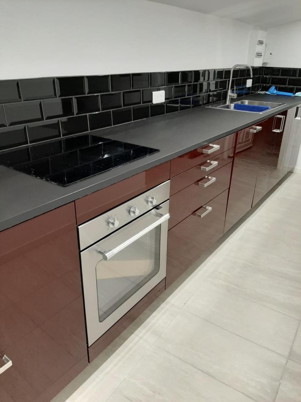 Kitchen or kitchenette, dishwasher, oven, stove