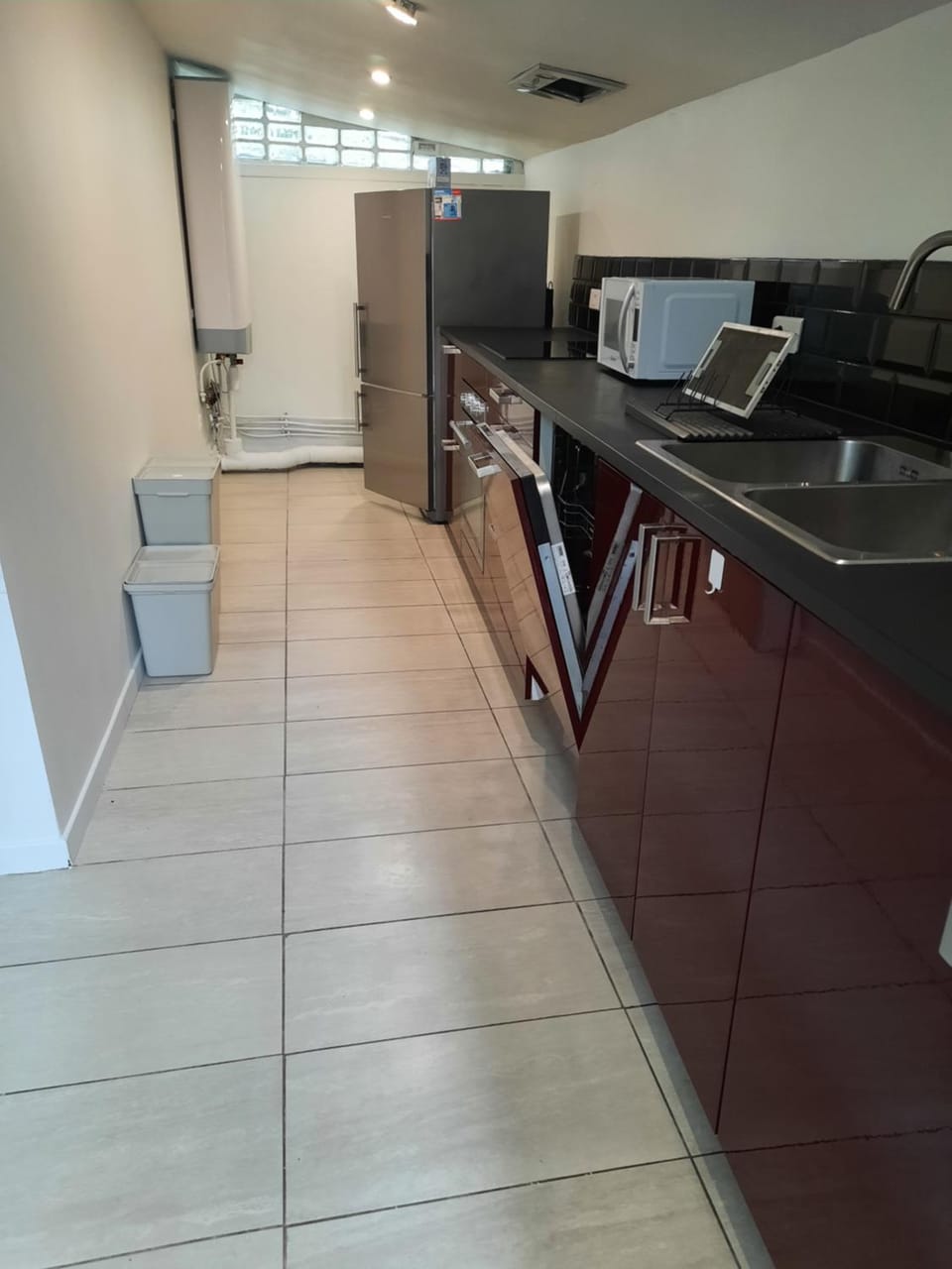 Kitchen or kitchenette, dishwasher, microwave, oven, stove