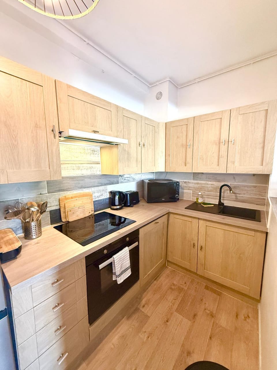 Kitchen or kitchenette, dishwasher, stove, toaster