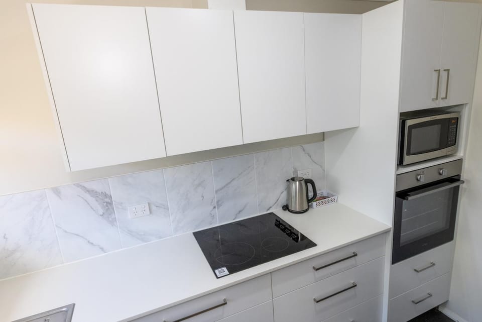 Kitchen or kitchenette, microwave, oven, stove, toaster