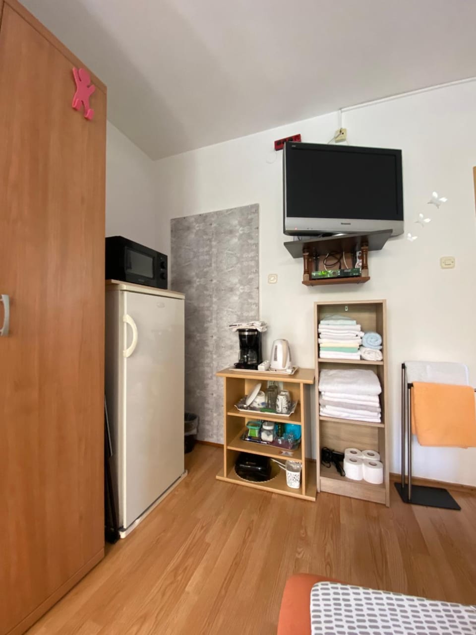 Bedroom, hair dryier, microwave, toaster, towels, wardrobe