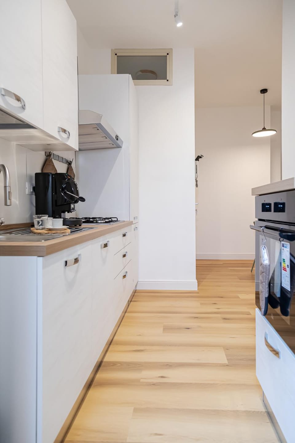 Kitchen or kitchenette, dishwasher, oven, stove