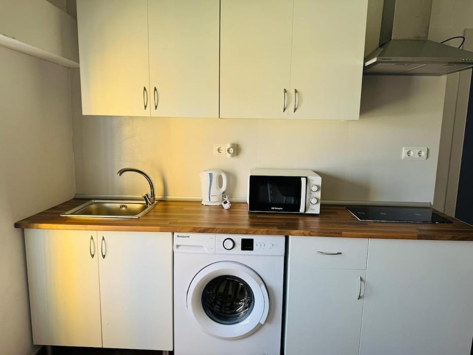Kitchen or kitchenette, washing machine