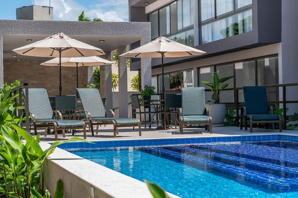 Property building, Patio, Day, Pool view, Swimming pool, sunbed