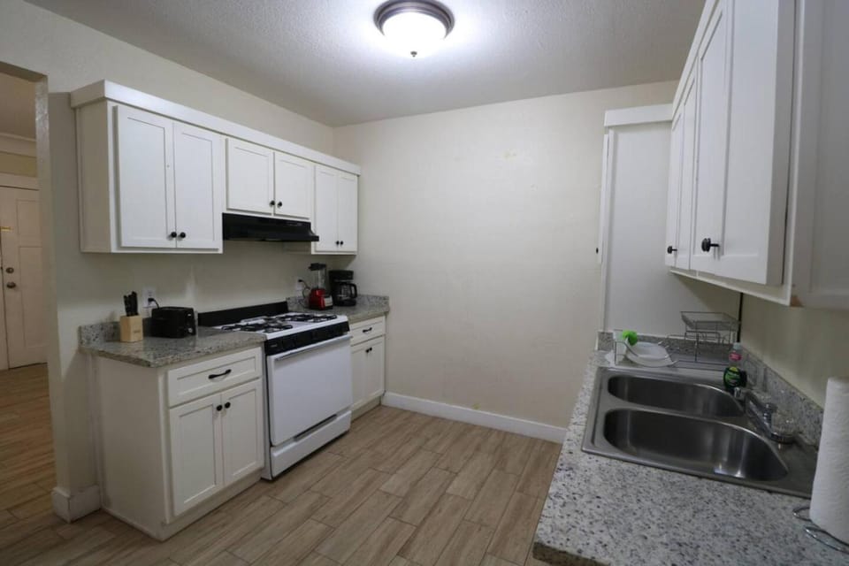 Kitchen or kitchenette, dishwasher, stove, toaster