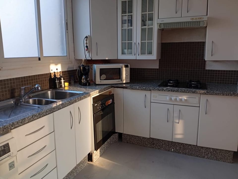 Kitchen or kitchenette, stove
