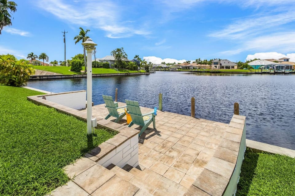 Riverfront Luxury with Heated Pool, Spa & Private Dock - Sunny Shores Escape House in Cape Coral