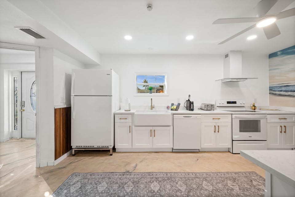 Kitchen or kitchenette, dishwasher, oven, stove