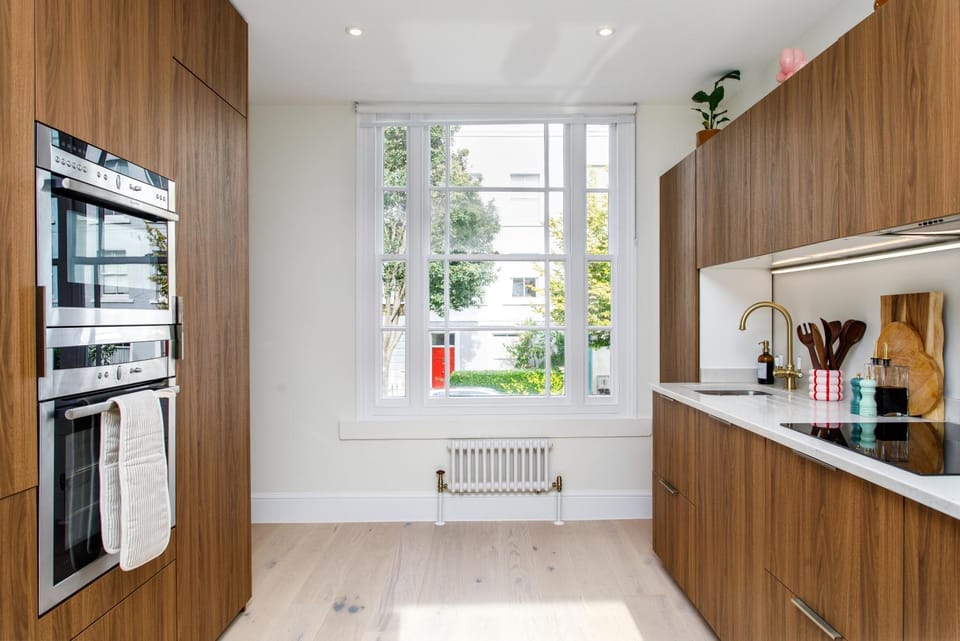 Kitchen or kitchenette, dishwasher, microwave, oven, stove