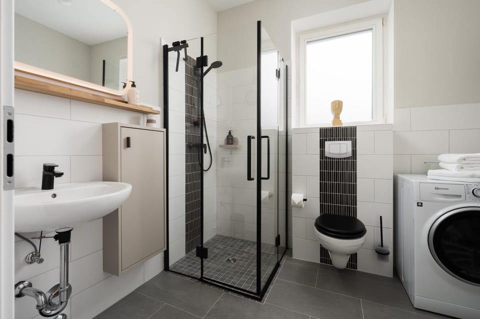 Shower, Toilet, Bathroom, towels, washing machine, dryer