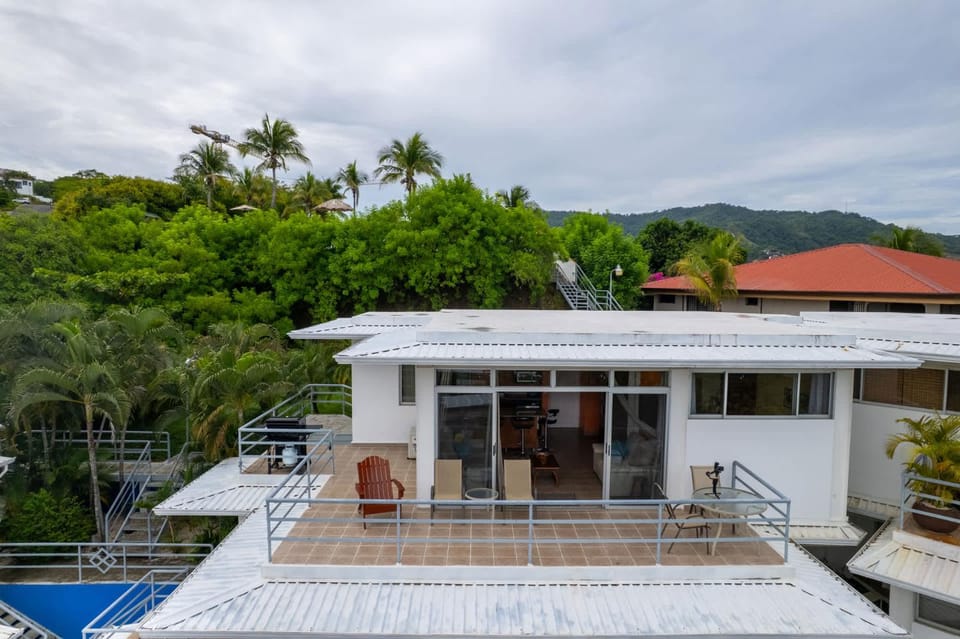 Modern Top-Floor Condo with Panoramic Views and Community Pool House in Coco