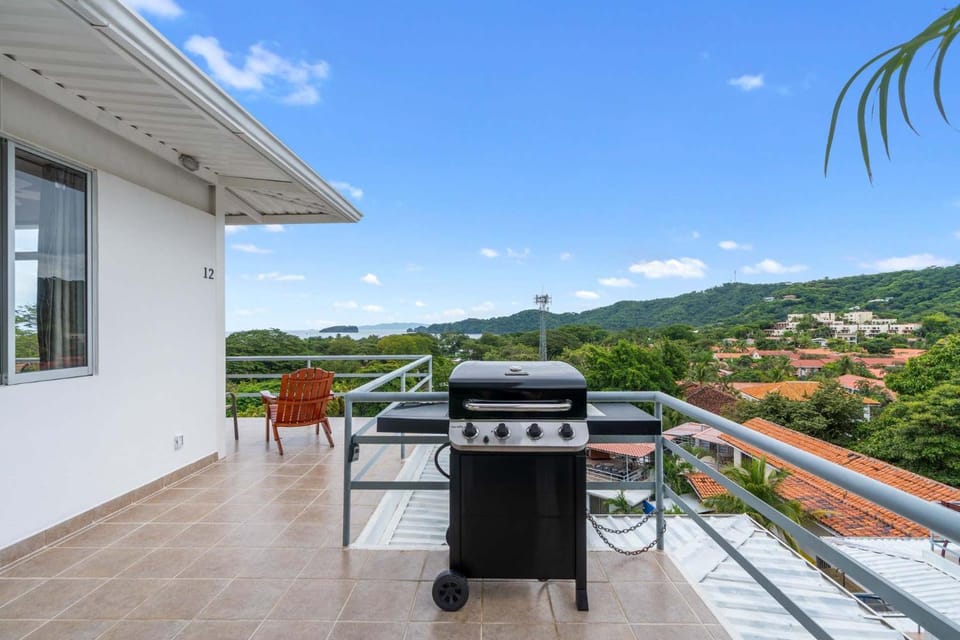 Modern Top-Floor Condo with Panoramic Views and Community Pool House in Coco