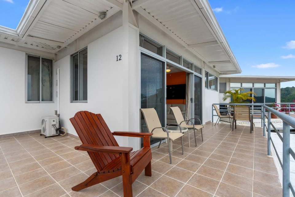 Modern Top-Floor Condo with Panoramic Views and Community Pool House in Coco