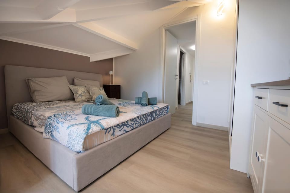 Bed, towels, wardrobe