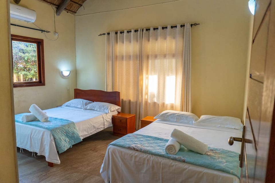 Bed, Photo of the whole room, Bedroom, towels, air conditioner