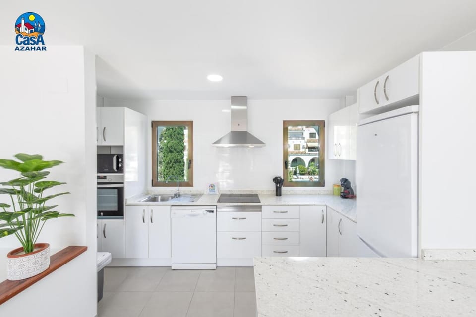 Kitchen or kitchenette, dishwasher, oven, stove
