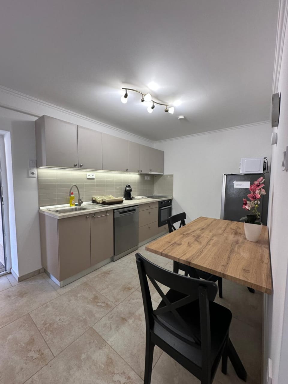 Kitchen or kitchenette, dishwasher, oven, stove