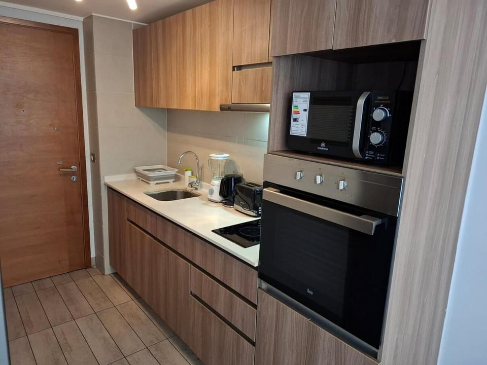 Kitchen or kitchenette, oven, stove, toaster