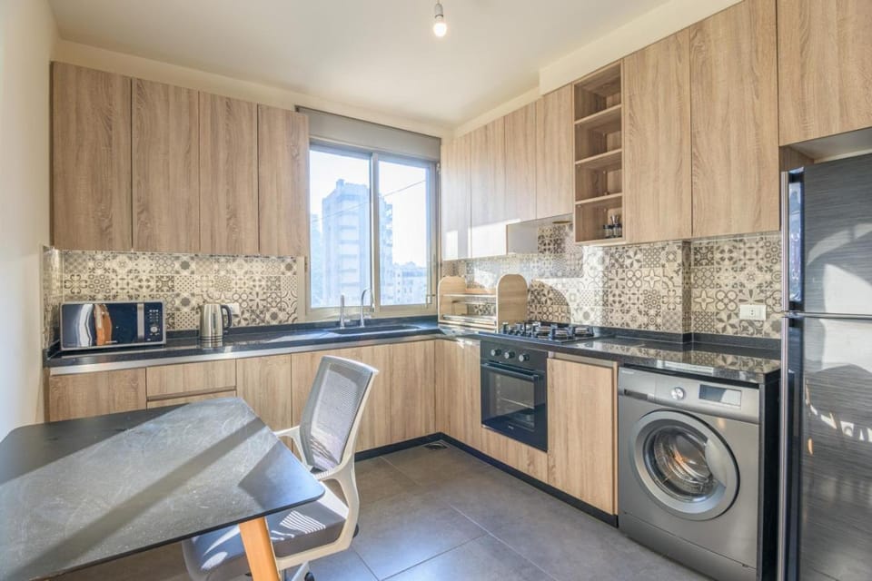 Kitchen or kitchenette, oven, stove, washing machine