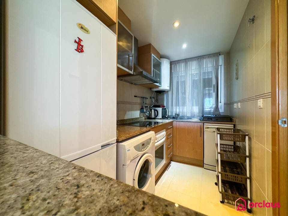 Kitchen or kitchenette, dishwasher, oven, stove, washing machine